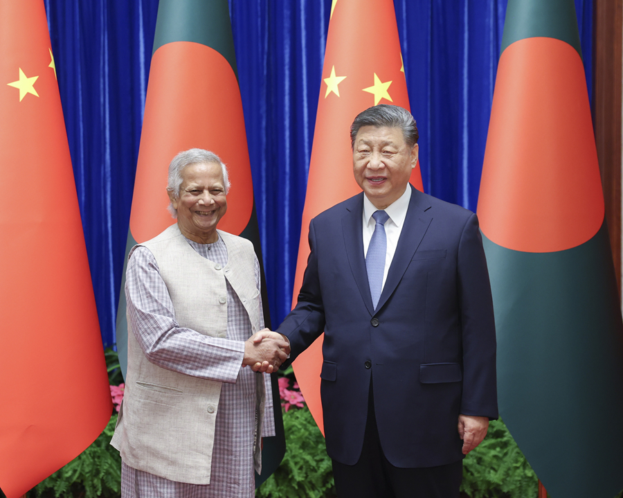 3月28日上午,国家主席习近平在北京人民大会堂会见孟加拉国临时政府首席顾问尤努斯。